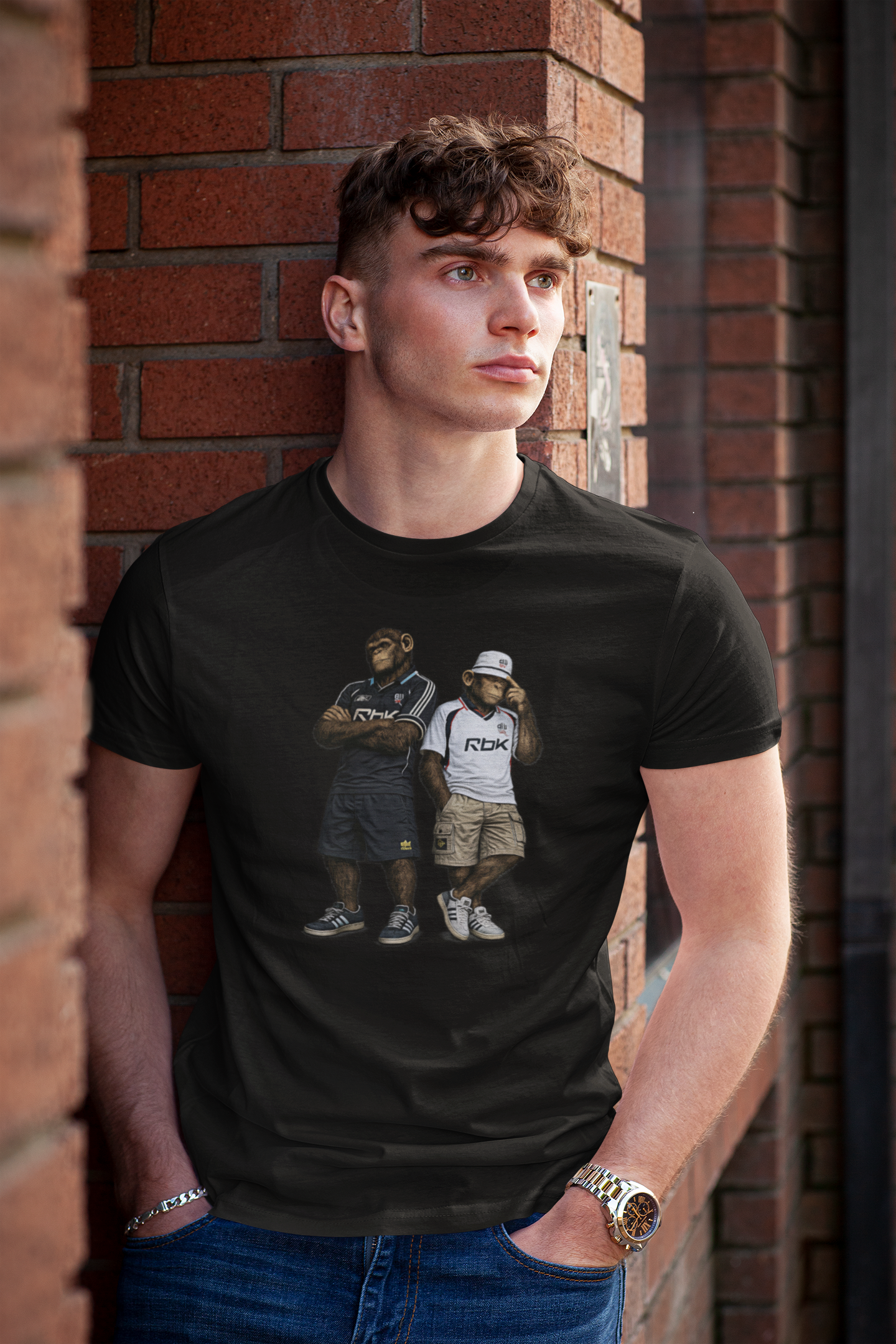 On The Terrace Northern Monkeys black graphic t-shirt featuring retro Bolton Wanderers inspired white and navy terrace casuals artwork.