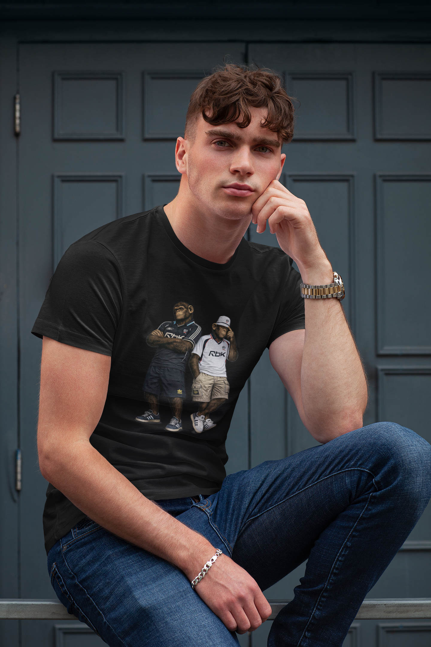 On The Terrace Northern Monkeys black graphic t-shirt featuring retro Bolton Wanderers inspired white and navy terrace casuals artwork.