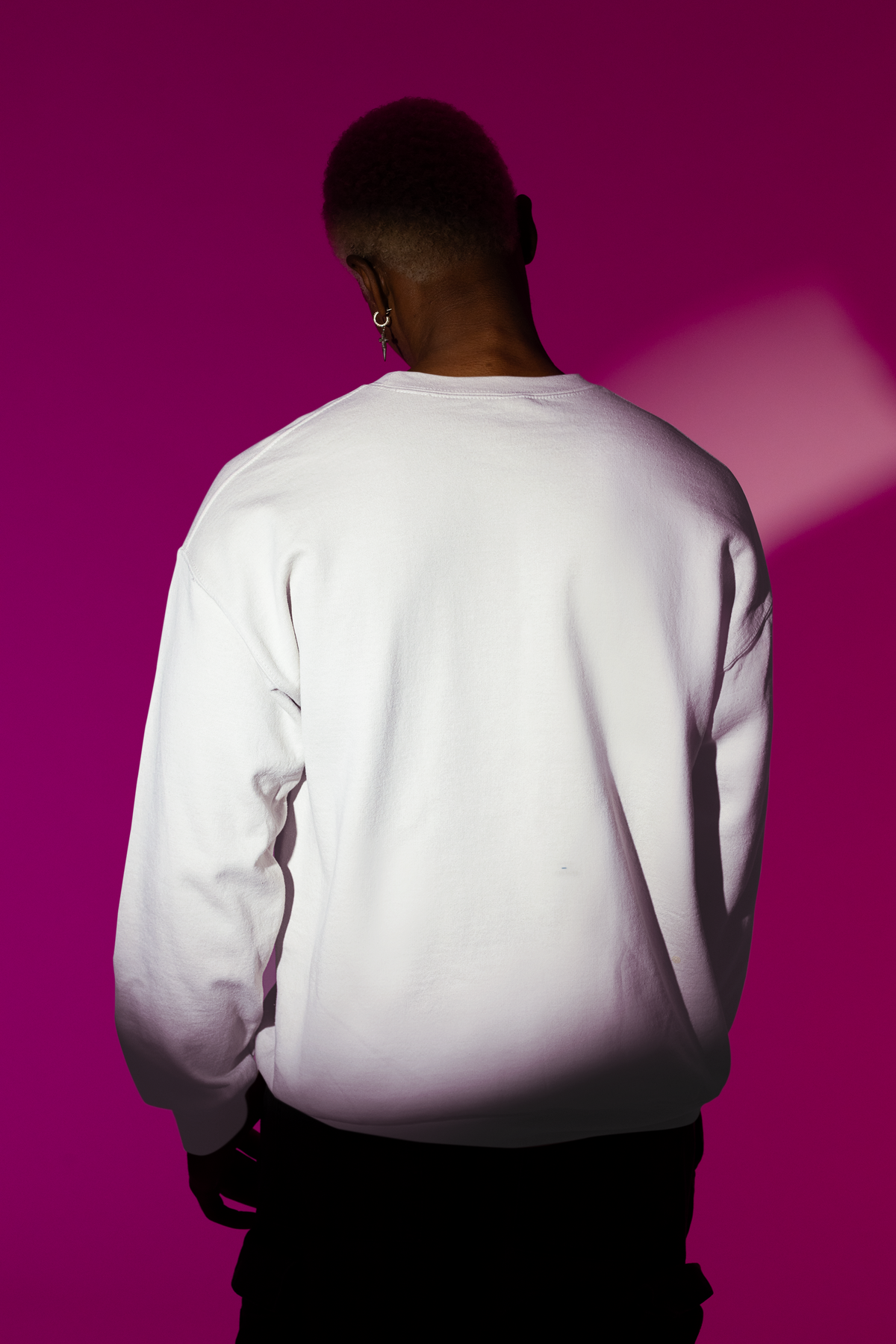 Back view of the plain white Weekend Uniform sweatshirt