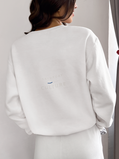 Back view of a woman wearing the white Style Before Kick-Off sweatshirt