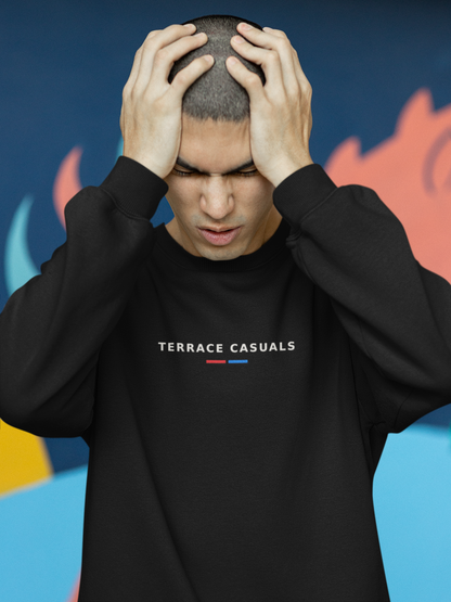 Man with hands on head wearing the black Terrace Casuals football casuals sweatshirt