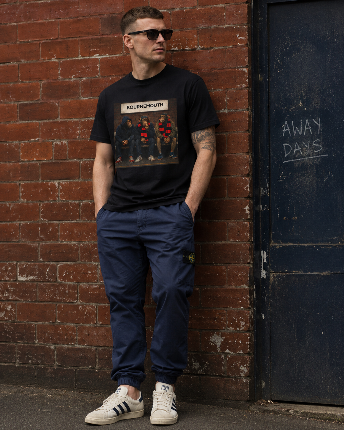 Man in a Bournemouth casuals graphic t-shirt, three chimps in red and black scarves on a bench, On The Terrace