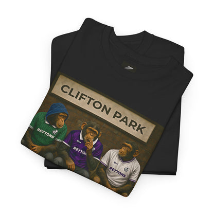 A folded black Reytons t-shirt on a white background, featuring a graphic print of three apes dressed in Reytons jerseys under a sign that reads 'CLIFTON PARK'.