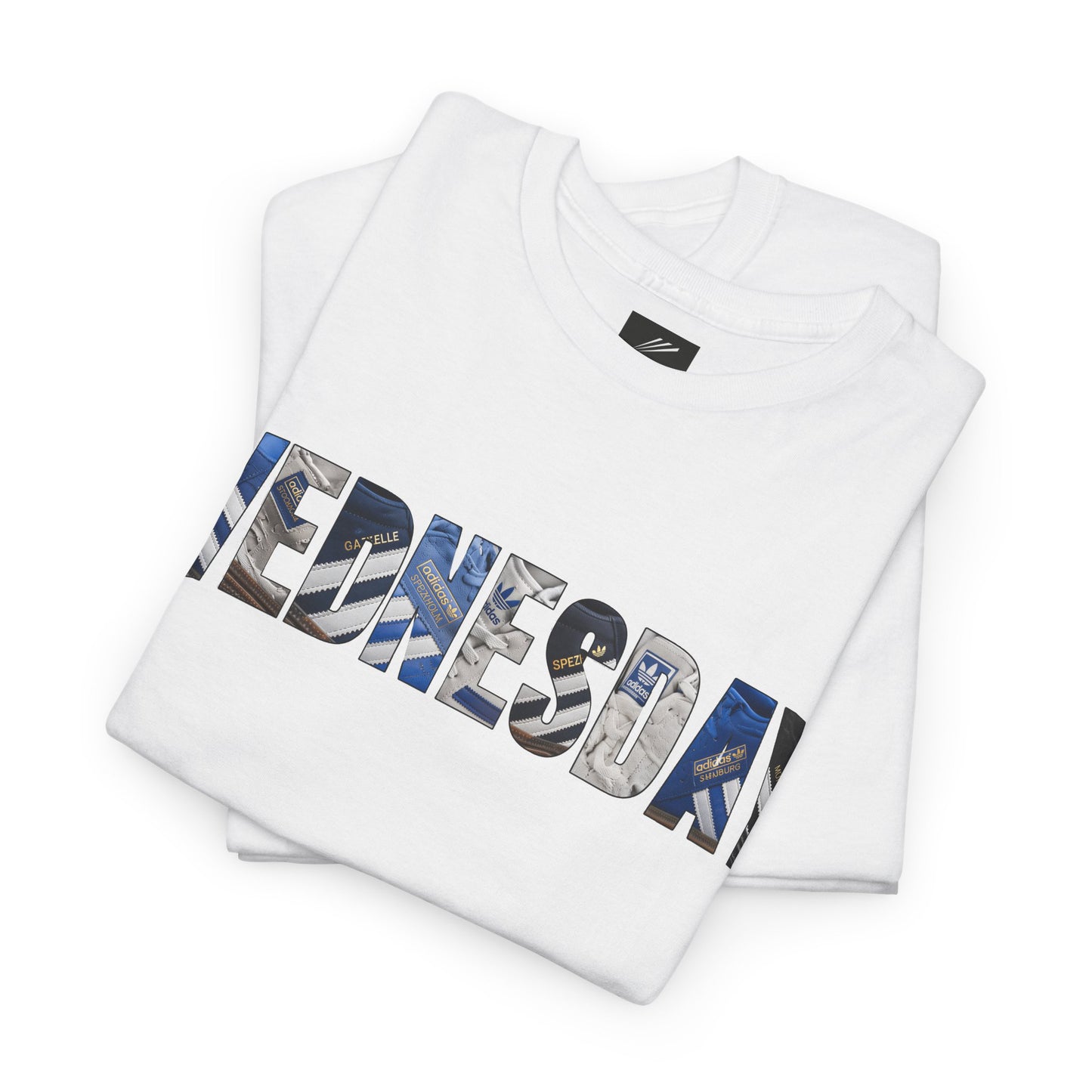 Folded white SWFC tee with WEDNESDAY block lettering filled with classic trainers