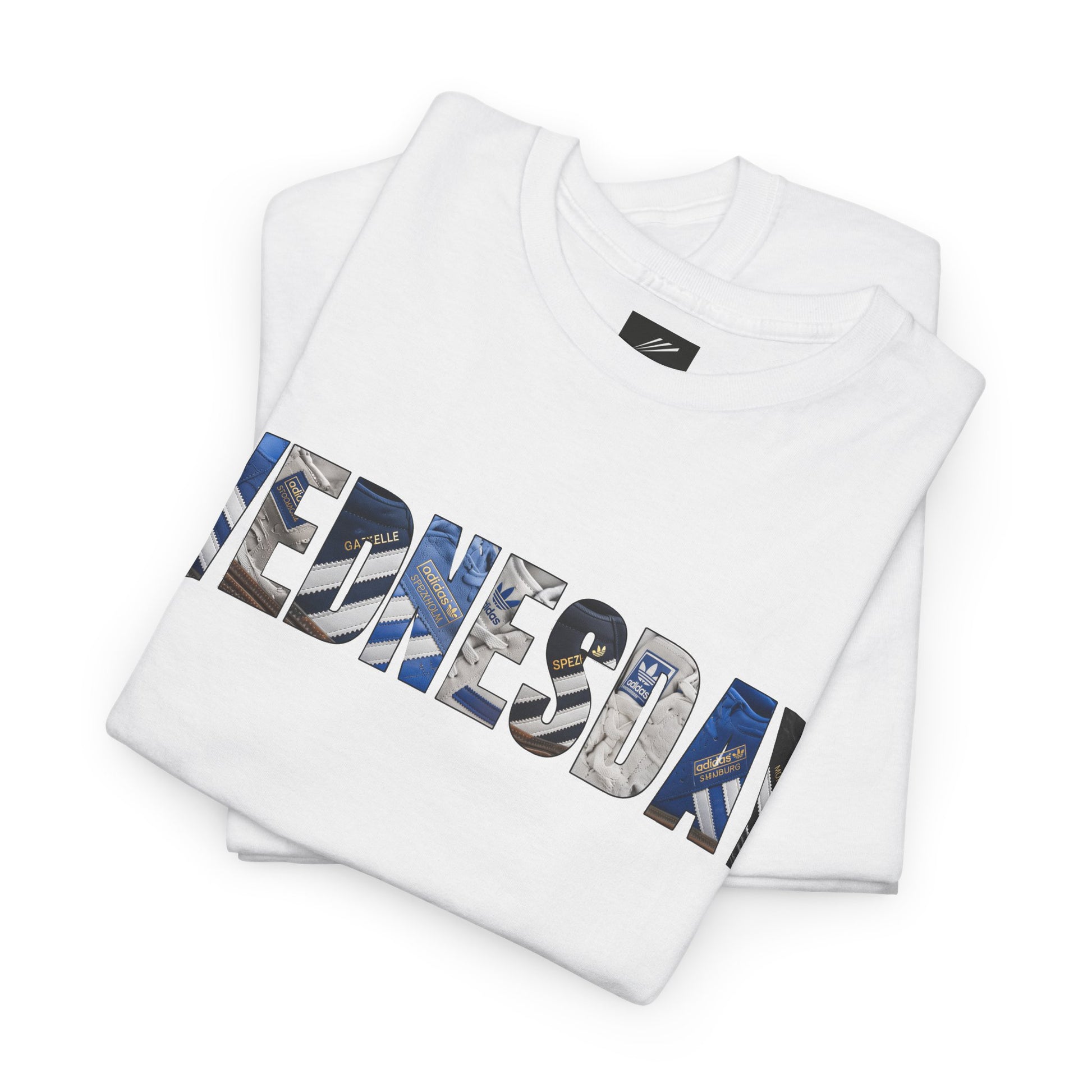 Folded white SWFC tee with WEDNESDAY block lettering filled with classic trainers
