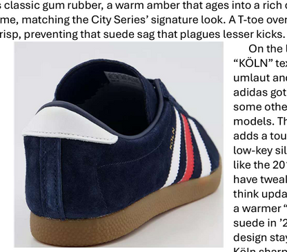 Navy blue sneaker with white, red, and white stripes on a light gray background
