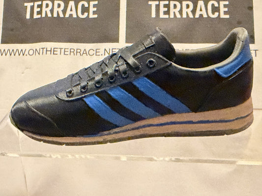 Painted 120 mm Marathon SPZL NG inspired 3D trainer model, black with blue stripes and heel detail and pale midsole, side view