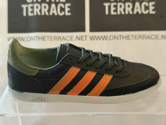 Painted adidas Spezial inspired 120 mm trainer model, black with orange stripes and olive heel, side view