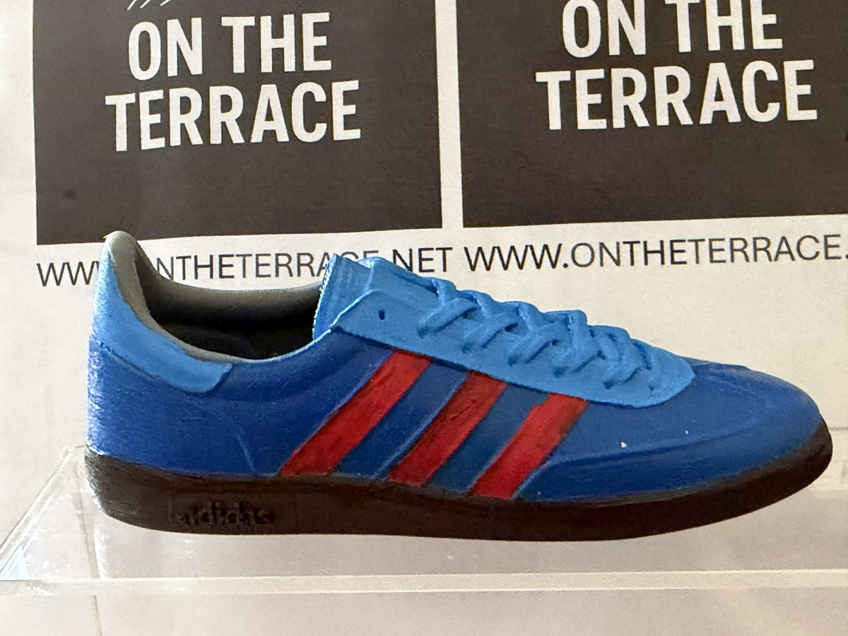 Blue and red painted Manchester inspired 120 mm trainer model, inner side