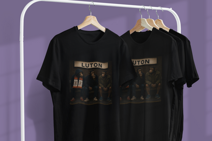 Two black Luton Town Terrace Monkeys T-shirts hanging on a clothing rail