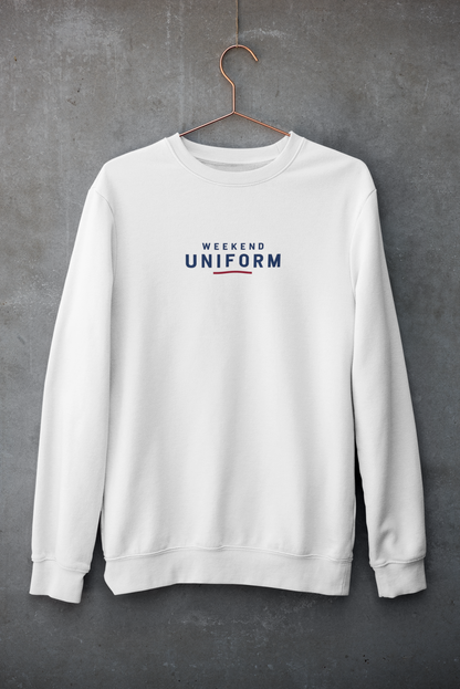 White Weekend Uniform embroidered sweatshirt on a hanger against a concrete wall