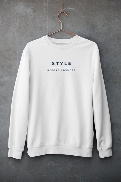 White Style Before Kick-Off sweatshirt on a hanger against a concrete wall