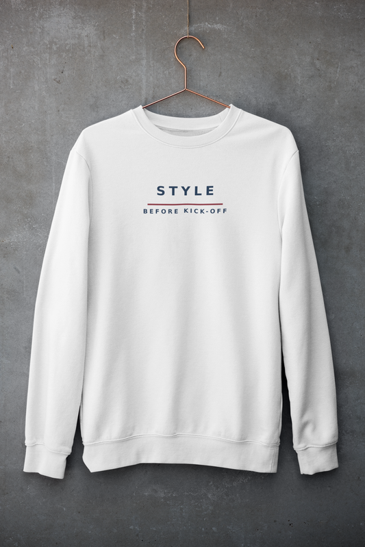 White Style Before Kick-Off sweatshirt on a hanger against a concrete wall