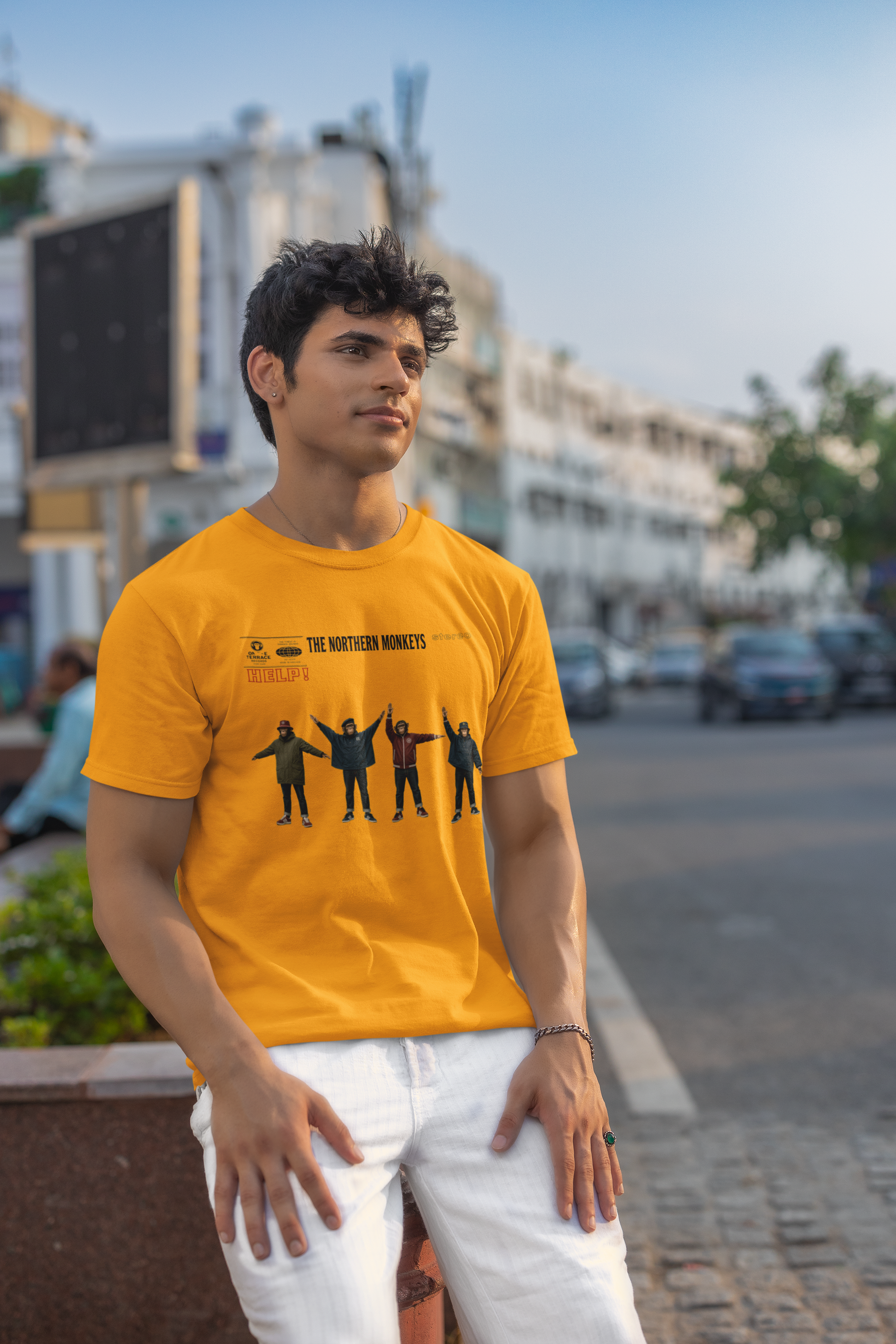 Man modelling mustard Beatles Help Casuals graphic T-shirt