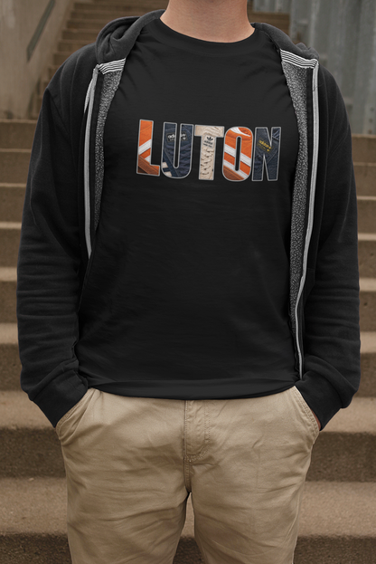 Man wearing black Luton Town Vintage Trainers T-shirt