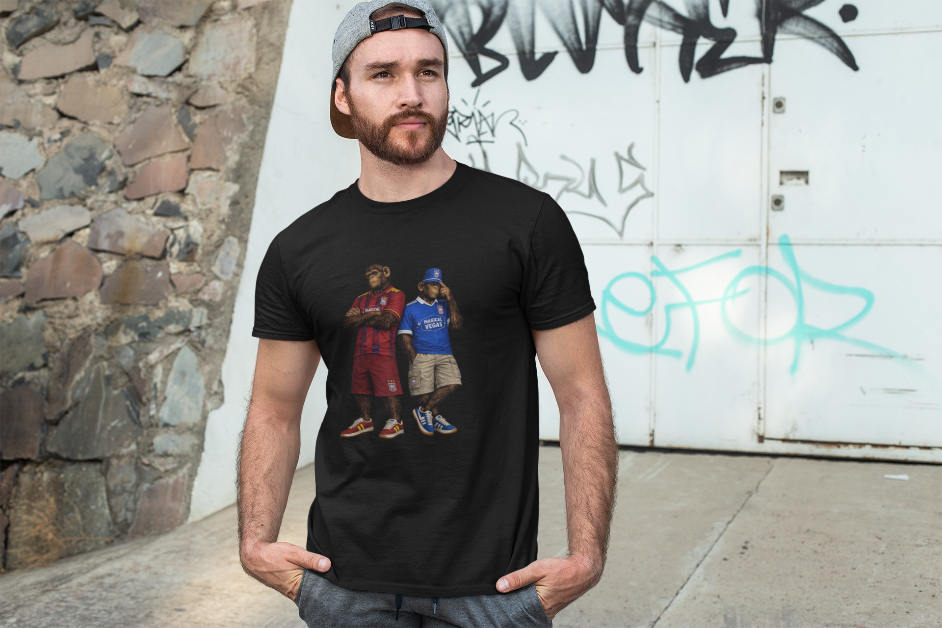 Man wearing a black Ipswich t-shirt with 'D&D Nerd' design in front of a graffiti-covered wall.
